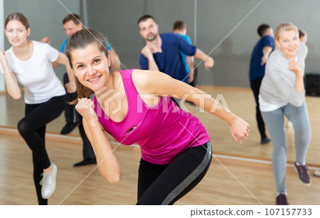 Young woman enjoying active dances 107157733