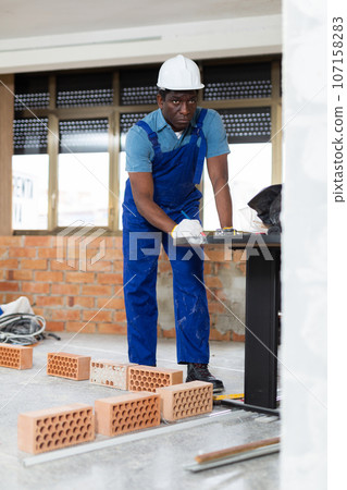 Foreman inspecting rooms and taking notes during renovation Foreman inspecting rooms and taking notes during renovation 107158283