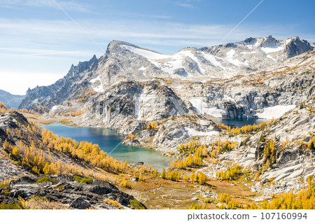 View over golden larch lined Perfection Lake in enchantment lakes wilderness View over golden larch lined Perfection Lake in enchantment lakes wilderness 107160994