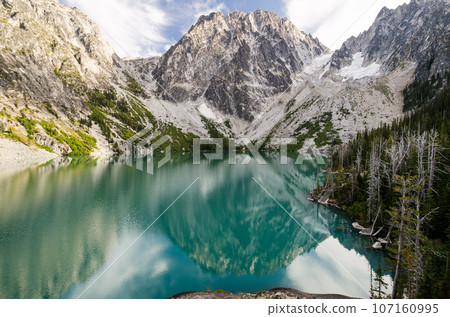 Granite Mountain reflection in turquoise Colchuck Lake in Enchantments Peak Wilderness 107160995