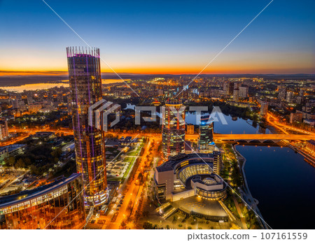 Yekaterinburg city and pond aerial panoramic view at summer or early autumn night. Night city in the early autumn or summer. 107161559