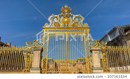 The golden gates of Versailles Castle in the city of Paris - CITY OF PARIS, FRANCE - SEPTEMBER 05 107161834