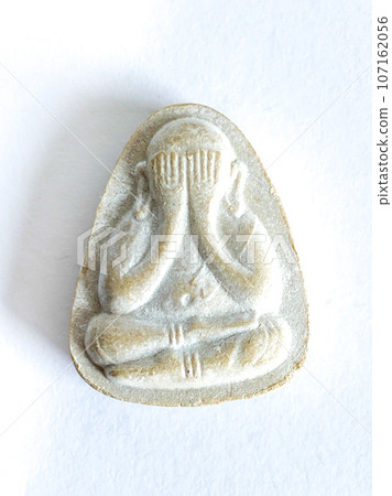 Thai old buddha amulet on white background Thai old buddha amulet on white background 107162056
