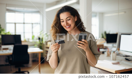 Woman is doing online purchases Woman is doing online purchases 107162457