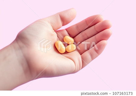 Close up hands showing prescription pills or medical pills or capsules 107163173