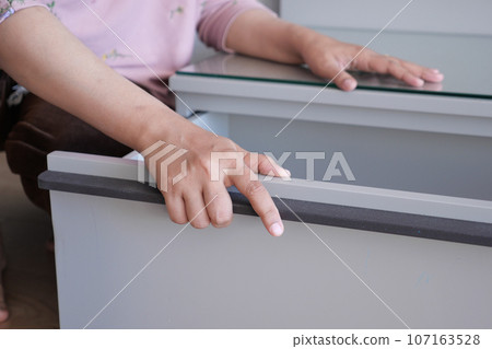 women hand open drawer wooden in cabinet women hand open drawer wooden in cabinet 107163528