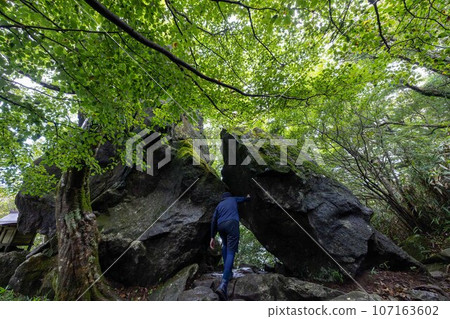 A man trying to dive into Mt. Tsukuba's Hokuto Rock A man trying to dive into Mt. Tsukuba's Hokuto Rock 107163602