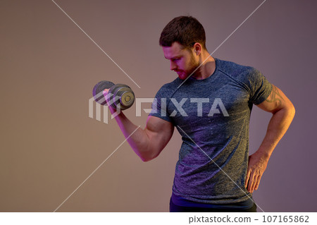 skilled bodybuilder bending his arm skilled bodybuilder bending his arm 107165862