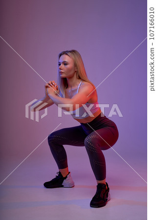 young ambitious strongwoman sportswear working out young ambitious strongwoman sportswear working out 107166010