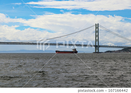 Tanker passing under Akashi Kaikyo Bridge 107166442