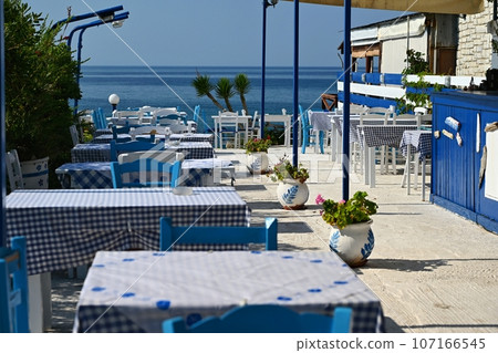 Classic Greek tavern. Corfu Island - Greece. Concept for summer holidays and vacation. Classic Greek tavern. Corfu Island - Greece. Concept for summer holidays and vacation. 107166545