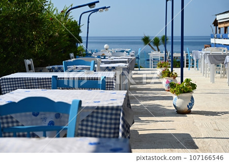 Classic Greek tavern. Corfu Island - Greece. Concept for summer holidays and vacation. Classic Greek tavern. Corfu Island - Greece. Concept for summer holidays and vacation. 107166546