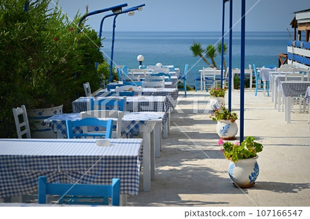 Classic Greek tavern. Corfu Island - Greece. Concept for summer holidays and vacation. 107166547