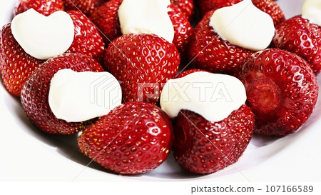 Strawberries. Healthy fresh summer fruit. Background with food. Yoghurt with fresh fruit 107166589