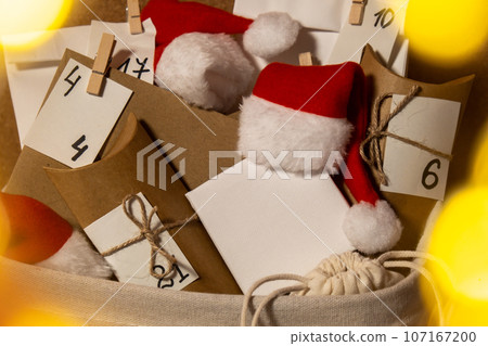 Original Advent Calendar for Christmas Homemade. Preparation to Christmas concept. Family winter holidays. Eco friendly presents gifts. open the package every day 107167200