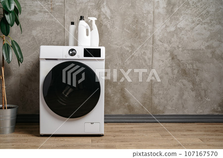 Washing machine in a gray modern laundry room Washing machine in a gray modern laundry room 107167570