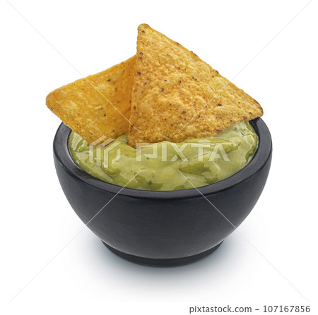 Guacamole and nachos isolated on white background, full depth of field 107167856