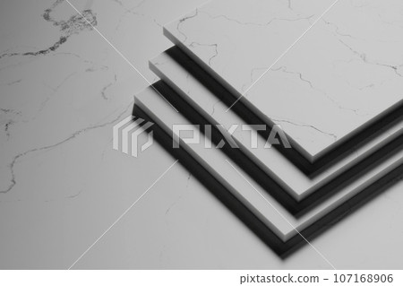 Simple black and white marble background with light streaming in. 107168906