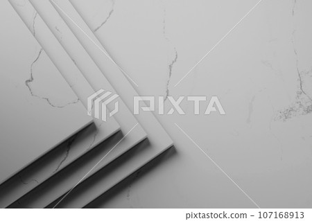 Simple black and white marble background with light streaming in. Simple black and white marble background with light streaming in. 107168913