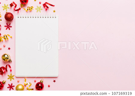 Christmas blank greeting card mock-up scene. Creative layout made of Christmas tree branches and paper card note. Flat lay. Nature New Year concept Christmas blank greeting card mock-up scene. Creative layout made of Christmas tree branches and paper card note. Flat lay. Nature New Year concept 107169319