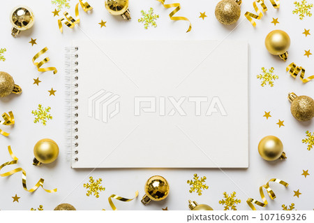 Christmas blank greeting card mock-up scene. Creative layout made of Christmas tree branches and paper card note. Flat lay. Nature New Year concept 107169326