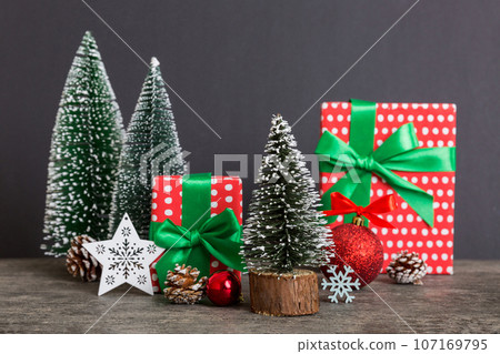 Christmas composition. craft Gift box, small tree, branches and craft DIY decorations on white background. New year concept. Christmas home decoration Flat lay, top view, copy space 107169795