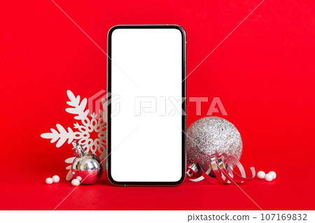 Digital phone mock up with rustic Christmas decorations for app presentation with empty space for you design. Christmas online shopping concept. Tablet with copy space on colored background 107169832