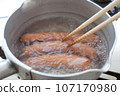 Scene of boiling three sausages, chopsticks included Scene of boiling three sausages, chopsticks included 107170980