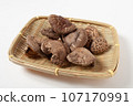 Shiitake mushrooms gathered in a colander, white background, can be cut out Shiitake mushrooms gathered in a colander, white background, can be cut out 107170991