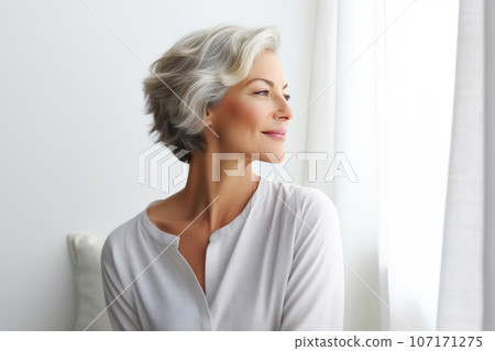 Pensive Middle-aged Woman in Solitude Pensive Middle-aged Woman in Solitude 107171275