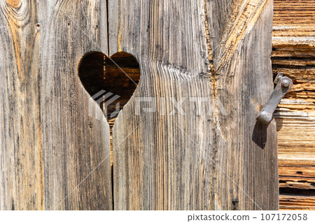 heart and old brown rustic dark grunge wooden texture - wood Background banner. heart and old brown rustic dark grunge wooden texture - wood Background banner. 107172058