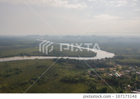 Aerial top view of a garden park with green mangrove forest trees, river, pond or lake. Nature landscape background, Thailand. Aerial top view of a garden park with green mangrove forest trees, river, pond or lake. Nature landscape background, Thailand. 107173148