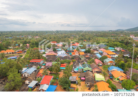 Aerial view of fishing trap net in canel with fisherman urban city village town houses, lake or river. Nature landscape fisheries and fishing tools at Pak Pha, Songkhla, Thailand. Aquaculture farming Aerial view of fishing trap net in canel with fisherman urban city village town houses, lake or river. Nature landscape fisheries and fishing tools at Pak Pha, Songkhla, Thailand. Aquaculture farming 107173226