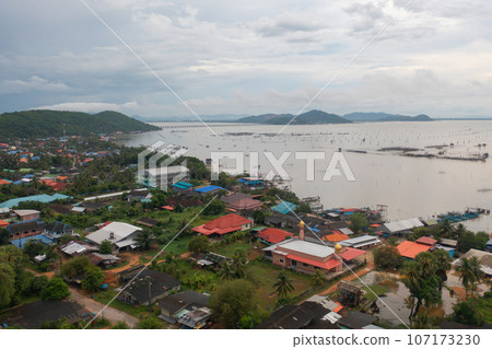 Aerial view of fishing trap net in canel with fisherman urban city village town houses, lake or river. Nature landscape fisheries and fishing tools at Pak Pha, Songkhla, Thailand. Aquaculture farming Aerial view of fishing trap net in canel with fisherman urban city village town houses, lake or river. Nature landscape fisheries and fishing tools at Pak Pha, Songkhla, Thailand. Aquaculture farming 107173230