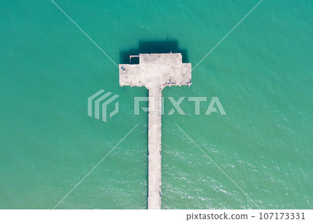 Aerial view of clear blue turquoise seawater, Andaman sea in Phuket island in summer season, Thailand. Water in ocean pattern texture wallpaper background. Aerial view of clear blue turquoise seawater, Andaman sea in Phuket island in summer season, Thailand. Water in ocean pattern texture wallpaper background. 107173331