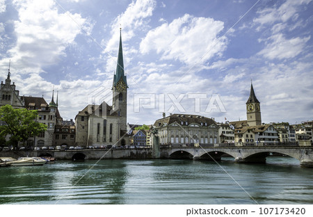 Scenic view of historic Zurich city center with famous Fraumunster and river Limmat at Lake Zurich,Switzerland 107173420
