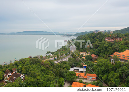 Aerial view of fishing trap net in canel with fisherman urban city village town houses, lake or river. Nature landscape fisheries and fishing tools at Pak Pha, Songkhla, Thailand. Aquaculture farming Aerial view of fishing trap net in canel with fisherman urban city village town houses, lake or river. Nature landscape fisheries and fishing tools at Pak Pha, Songkhla, Thailand. Aquaculture farming 107174031