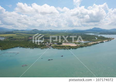 Aerial view of clear blue turquoise seawater, Andaman sea in Phuket island in summer season, Thailand. Water in ocean pattern texture wallpaper background. 107174072