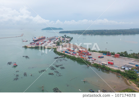 Aerial view of fishing trap net in canel with fisherman urban city village town houses, lake or river. Nature landscape fisheries and fishing tools at Pak Pha, Songkhla, Thailand. Aquaculture farming Aerial view of fishing trap net in canel with fisherman urban city village town houses, lake or river. Nature landscape fisheries and fishing tools at Pak Pha, Songkhla, Thailand. Aquaculture farming 107174078