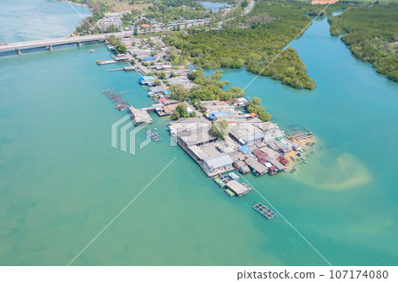 Aerial view of clear blue turquoise seawater, Andaman sea in Phuket island in summer season, Thailand. Water in ocean pattern texture wallpaper background. 107174080