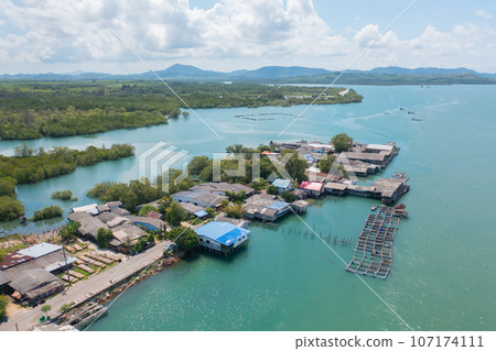 Aerial view of clear blue turquoise seawater, Andaman sea in Phuket island in summer season, Thailand. Water in ocean pattern texture wallpaper background. 107174111