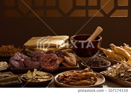 Vintage background for promotional products with ingredients from traditional medicinal herbs. Medicines originating from ancient China, health-protecting foods Vintage background for promotional products with ingredients from traditional medicinal herbs. Medicines originating from ancient China, health-protecting foods 107174338