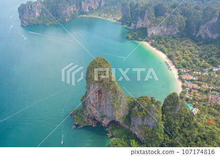 Aerial view of clear blue turquoise seawater, Andaman sea in Phuket island in summer season, Thailand. Water in ocean pattern texture wallpaper background. Aerial view of clear blue turquoise seawater, Andaman sea in Phuket island in summer season, Thailand. Water in ocean pattern texture wallpaper background. 107174816