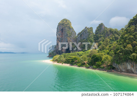 Aerial view of clear blue turquoise seawater, Andaman sea in Phuket island in summer season, Thailand. Water in ocean pattern texture wallpaper background. 107174864
