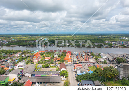 Aerial view of fishing trap net in canel with fisherman urban city village town houses, lake or river. Nature landscape fisheries and fishing tools at Pak Pha, Songkhla, Thailand. Aquaculture farming Aerial view of fishing trap net in canel with fisherman urban city village town houses, lake or river. Nature landscape fisheries and fishing tools at Pak Pha, Songkhla, Thailand. Aquaculture farming 107174913