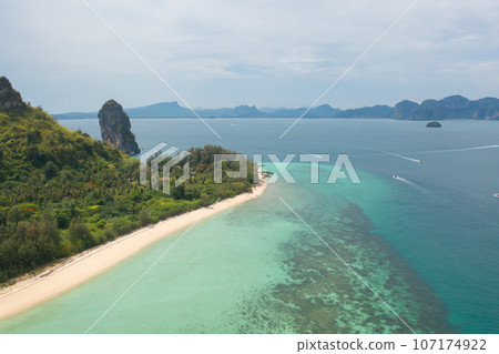 Aerial view of clear blue turquoise seawater, Andaman sea in Phuket island in summer season, Thailand. Water in ocean pattern texture wallpaper background. Aerial view of clear blue turquoise seawater, Andaman sea in Phuket island in summer season, Thailand. Water in ocean pattern texture wallpaper background. 107174922