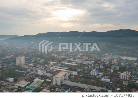Aerial view of residential neighborhood roofs. Urban housing development from above. Top view. Real estate in Phuket, southern province city, Thailand. Property real estate. Aerial view of residential neighborhood roofs. Urban housing development from above. Top view. Real estate in Phuket, southern province city, Thailand. Property real estate. 107174923