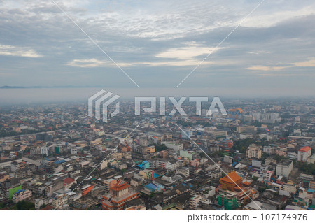 Aerial view of residential neighborhood roofs. Urban housing development from above. Top view. Real estate in Phuket, southern province city, Thailand. Property real estate. Aerial view of residential neighborhood roofs. Urban housing development from above. Top view. Real estate in Phuket, southern province city, Thailand. Property real estate. 107174976