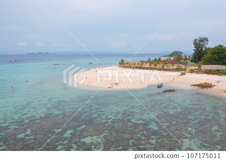 Aerial view of clear blue turquoise seawater, Andaman sea in Phuket island in summer season, Thailand. Water in ocean pattern texture wallpaper background. Aerial view of clear blue turquoise seawater, Andaman sea in Phuket island in summer season, Thailand. Water in ocean pattern texture wallpaper background. 107175011
