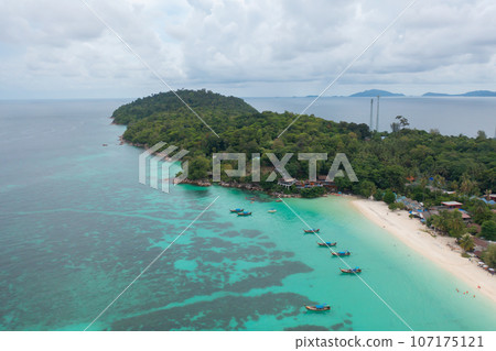 Aerial view of clear blue turquoise seawater, Andaman sea in Phuket island in summer season, Thailand. Water in ocean pattern texture wallpaper background. 107175121